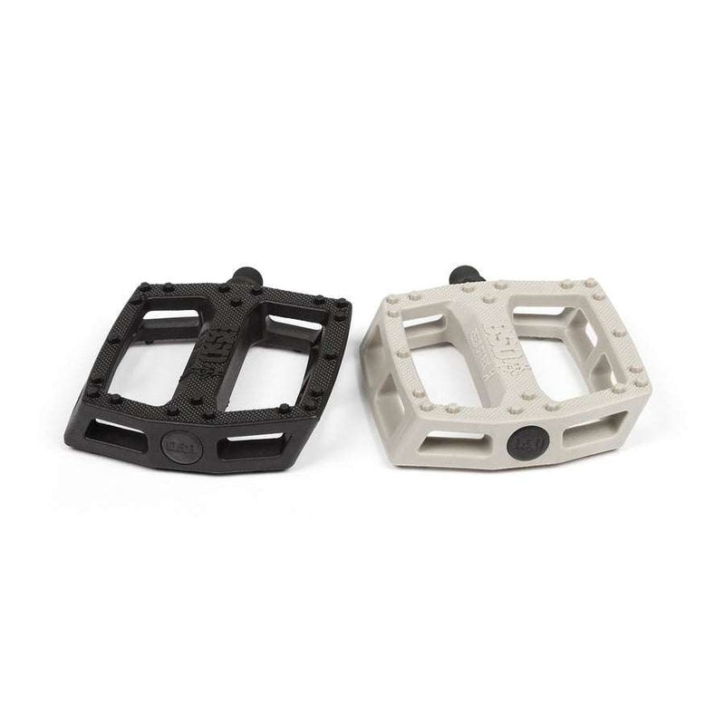 Pair of BSD SAFARI Pedals in black and white with dual concave design and hexagonal pins for grip and durability.