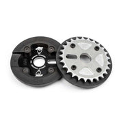BSD Jonesin' Sprocket 25t made of tough 7075-T6 aluminum with high-density nylon guard and hardened chromo hardware, available in black or raw finish.