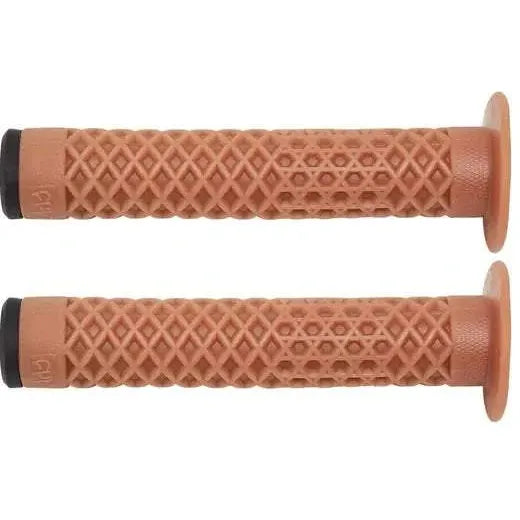 Pair of brown Cult VANS waffle grips with flange for BMX bikes, made from soft Krayton rubber.