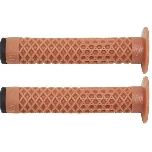 Pair of brown Cult VANS waffle grips with flange for BMX bikes, made from soft Krayton rubber.