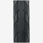 Close-up of TIOGA SPECTR TIRE showing rounded tread with GripPod clusters and deep grooves for enhanced cornering grip.