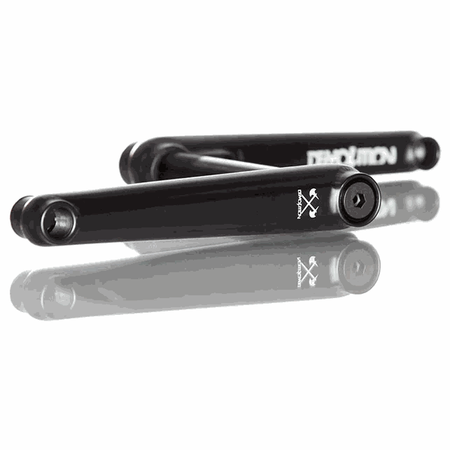 Black Demolition Revolt cranks with heat-treated chromoly arms and forged spindle, designed for durability and stiffness.