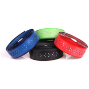 ODI bar tape high performance rolls in blue, green, black, and red with perforated design for shock absorption and grip