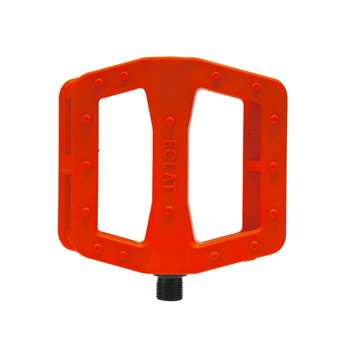 Orange bicycle pedal with 'Eclat' branding on a light gray background