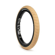 ÉCLAT FIREBALL TIRE with tan tread and black sidewall, designed for street riding, featuring grind-resistant tread and puncture-proof cobweb layer.