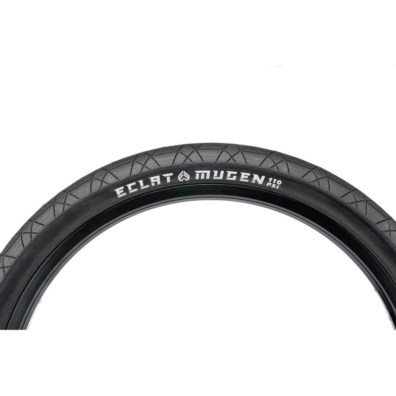 Éclat Mugen Tire, black, designed for flatland BMX, high-pressure 110 PSI, unique race-spec rubber, and micro-textured surface for enhanced grip.
