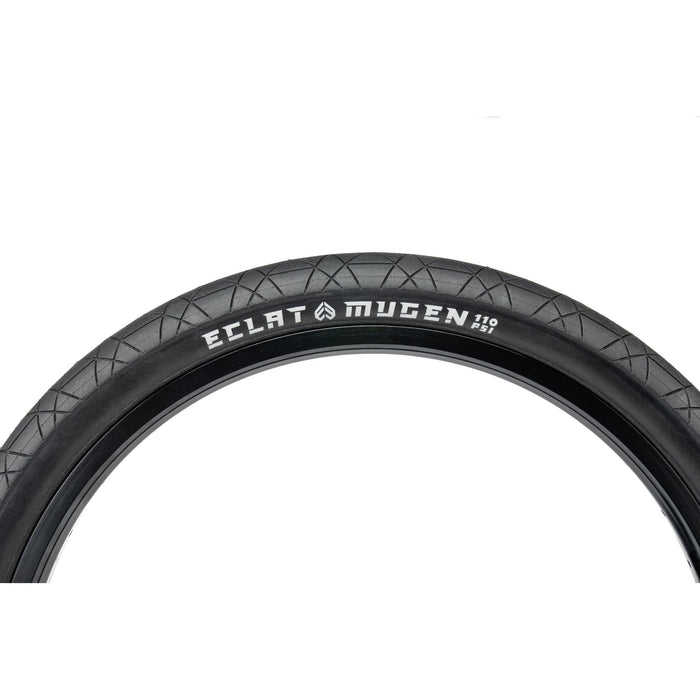 Éclat Mugen Tire, black, designed for flatland BMX, high-pressure 110 PSI, unique race-spec rubber, and micro-textured surface for enhanced grip.