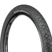 Éclat Mugen Tire for flatland BMX, black, ultra-round profile with micro-textured surface.
