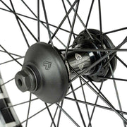 Close-up of ÉCLAT BONDI/CORTEX OS front wheel with black hub, stainless steel spokes, and durable axle components