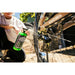 Person using KRUSH ULTRA drivetrain degreaser spray on bicycle chain outdoors