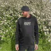 Man wearing black MARIE JADE x BUDDY MFG embroidered hooded sweater with kangaroo pocket outdoors
