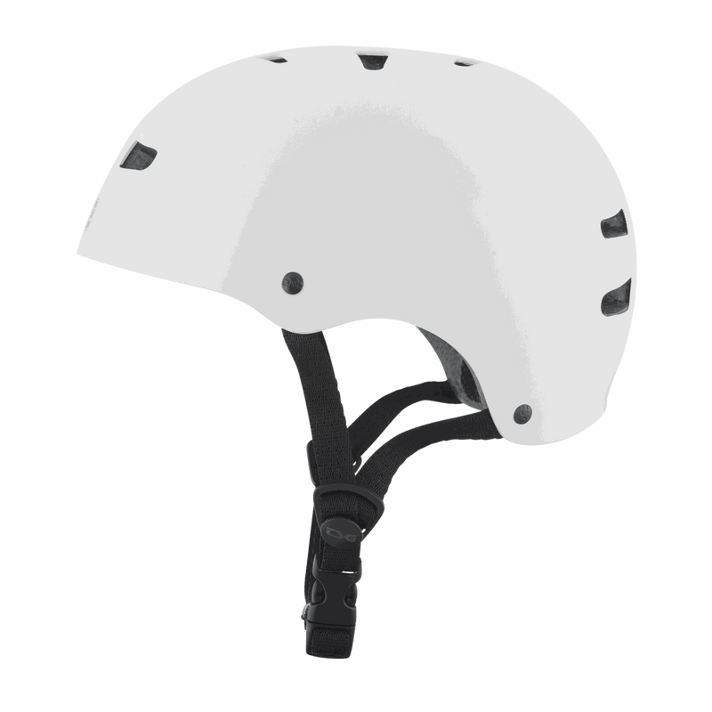 White TSG Skate/BMX helmet with black adjustable chin strap and ventilation holes, half-shell design for skate and BMX protection.
