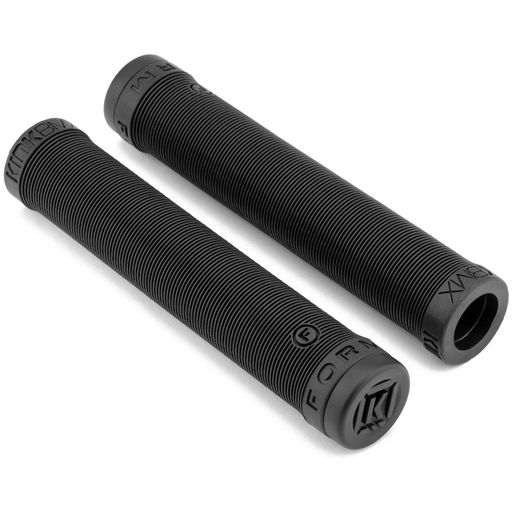 Pair of black Kink Form grips made from soft Kraton rubber with ribbed texture and plug type barends for BMX handlebars.