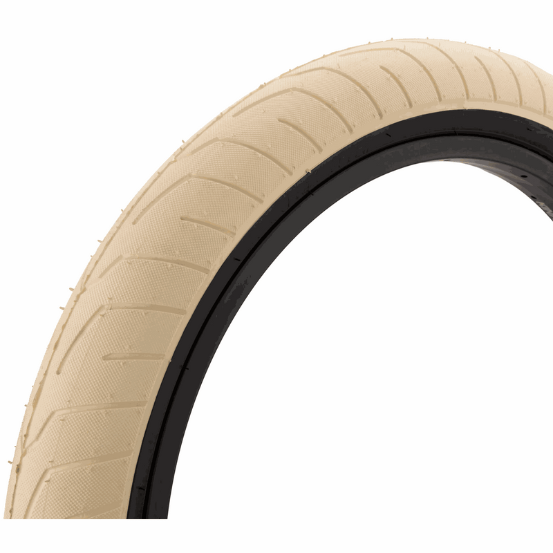 KINK Sever tire in beige with low profile tread and micro-knurled surface for grip and durability
