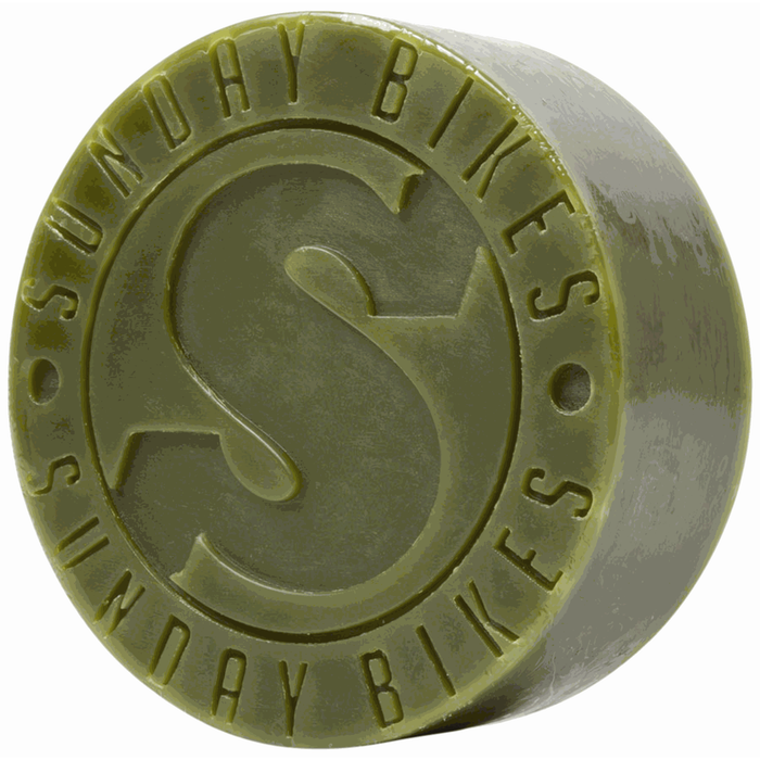 Green Sunday Puck Grind Wax for street ledges and bike grinding with embossed logo.