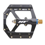HT COMPONENTS AE03 EVO+ black aluminum CNC machined bicycle pedal with gold spindle and replaceable grip pins