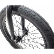 Close-up of front 18-inch wheel and tire on Verde Cadet 18 BMX bike with black spokes and fork