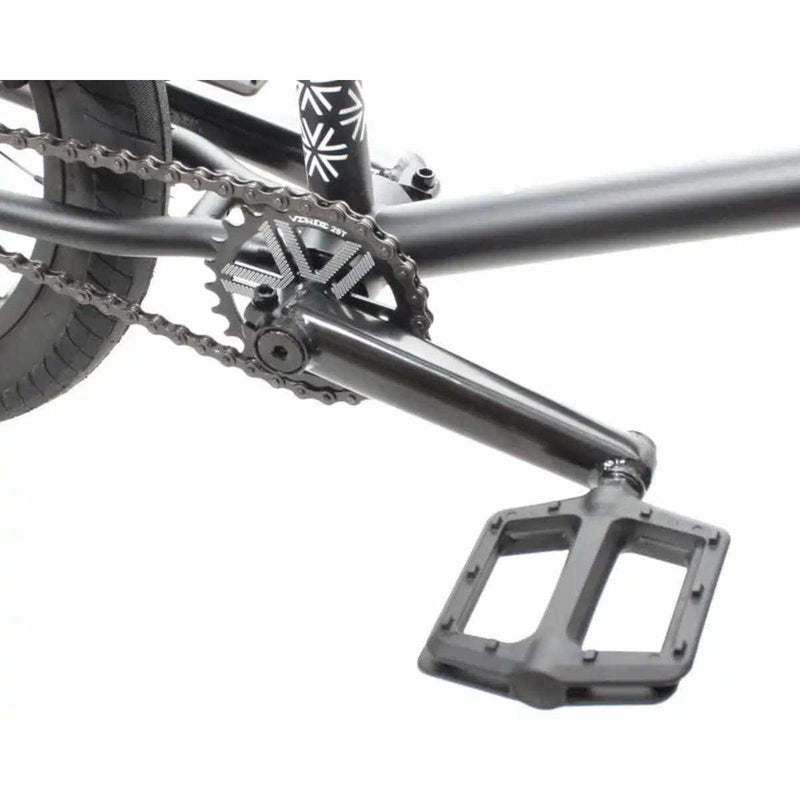 Close-up of black chromoly crank and nylon composite pedal on Verde Cadet 18 BMX bike for kids