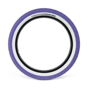 WETHEPEOPLE ACTIVATE TIRE with purple tread and white sidewall, designed for durability and grip.