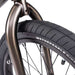Close-up of Wethepeople Justice Bike front tire and fork showing black Activate tire and 22mm offset Saltplus Justice fork