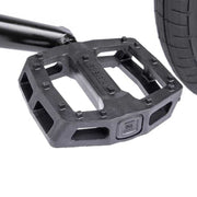 Close-up of Wethepeople Justice Bike black nylon fiberglass logic pedal near rear tire