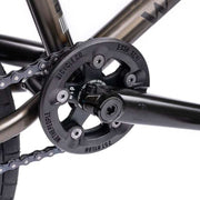 Close-up of the Wethepeople Justice bike crankset with Paragon plastic guard and chain in black finish