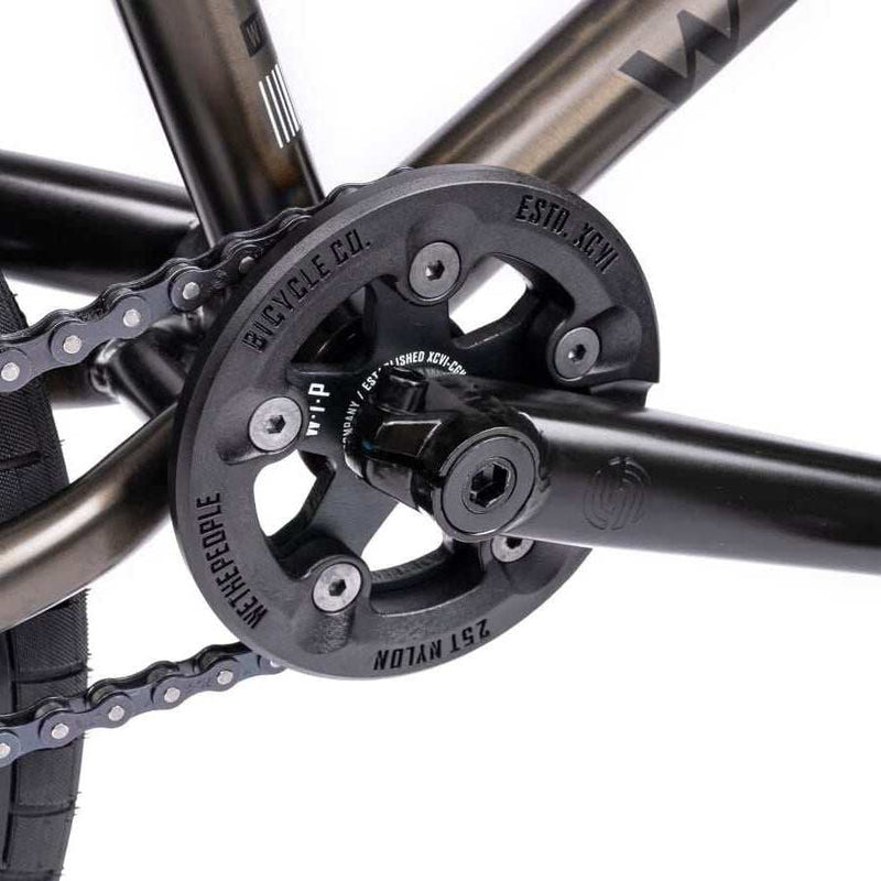 Close-up of the Wethepeople Justice bike crankset with Paragon plastic guard and chain in black finish