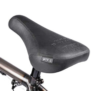 Close-up of black Wethepeople Justice Bike padded seat with logo on a BMX frame