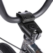 Close-up of black handlebar, stem, and headset of WETHEPEOPLE JUSTICE BIKE with a sleek matte finish.