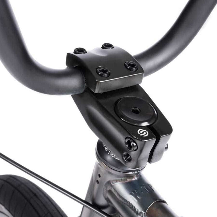 Close-up of black handlebar, stem, and headset of WETHEPEOPLE JUSTICE BIKE with a sleek matte finish.