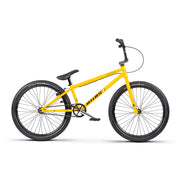 Yellow WETHEPEOPLE THE ATLAS BMX bike with 24-inch wheels and black tires against white background