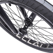 Close-up of the WETHEPEOPLE TRUST CS Complete Bike's wheel featuring éclat "cortex" hub and "trippin" rim.