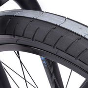 Close-up of WETHEPEOPLE TRUST CS bike tire showcasing robust tread design.