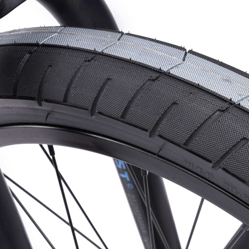 Close-up of WETHEPEOPLE TRUST CS bike tire showcasing robust tread design.