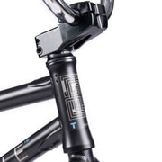 Close-up of the WETHEPEOPLE TRUST CS Complete Bike frame and handlebars, showcasing the sleek black design and high-quality components.