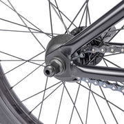 Rear wheel and chain of WETHEPEOPLE TRUST CS Complete Bike, featuring a durable design and high-performance components.