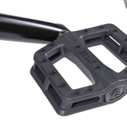 BMX bike pedal on the WETHEPEOPLE TRUST CS, featuring durable nylon/fiberglass construction.