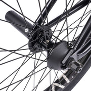 Close-up of rear wheel and hub guard on WETHEPEOPLE TRUST CS Complete Bike.