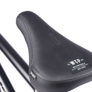 WETHEPEOPLE TRUST CS bike seat detail showcasing quality stitching and branded design.