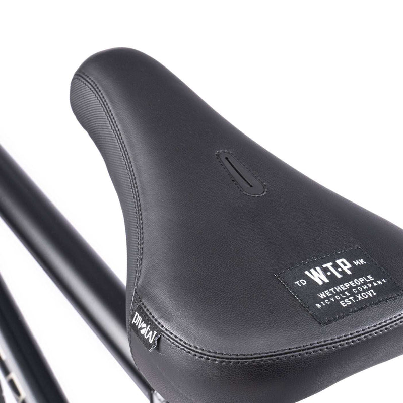 WETHEPEOPLE TRUST CS bike seat detail showcasing quality stitching and branded design.