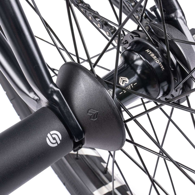 Close-up view of WETHEPEOPLE TRUST CS bike hub and pegs showcasing high-quality components.