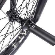 Close-up of WETHEPEOPLE TRUST CS bike wheel and hub with black nylon peg.
