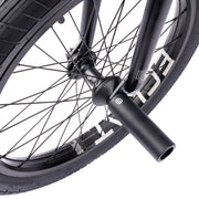 Close-up of the WETHEPEOPLE TRUST CS bike's rear wheel and hub, featuring a robust design with éclat hub and nylon peg.