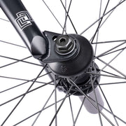 Close-up of the front hub on the WETHEPEOPLE TRUST CS complete bike, featuring éclat "cortex" hub with fully sealed bearings.