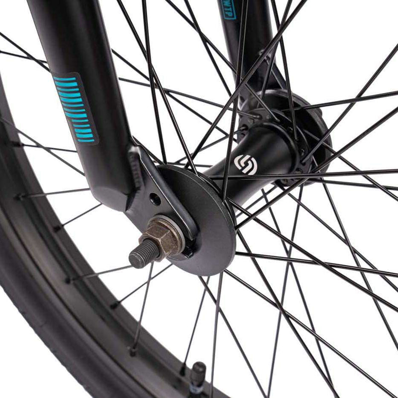 Close-up of the front wheel hub and spokes on the Wethepeople Justice Bike with black fork and tire details