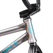 Close-up of the Wethepeople Justice Bike frame and black handlebars showing weld details and logo decal