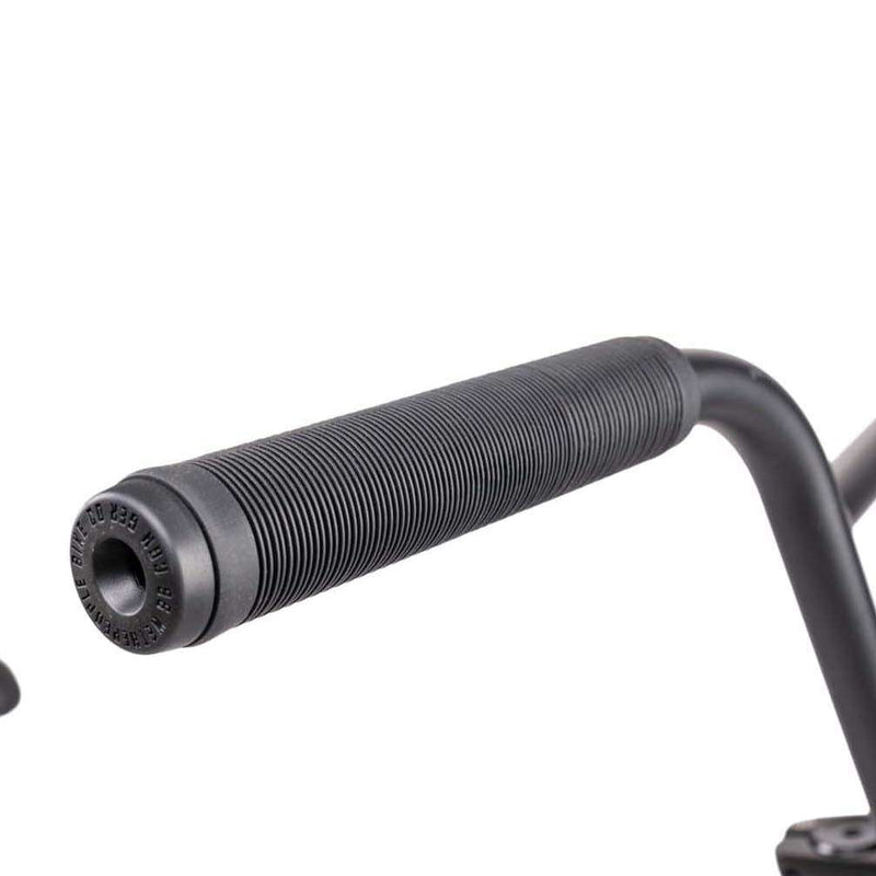Close-up of black Wethepeople Justice bike handlebar grip on black metal bar