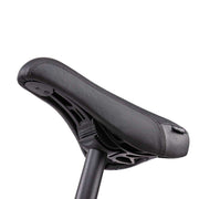 Close-up of the black Wethepeople Justice Bike padded saddle and seat post against a white background
