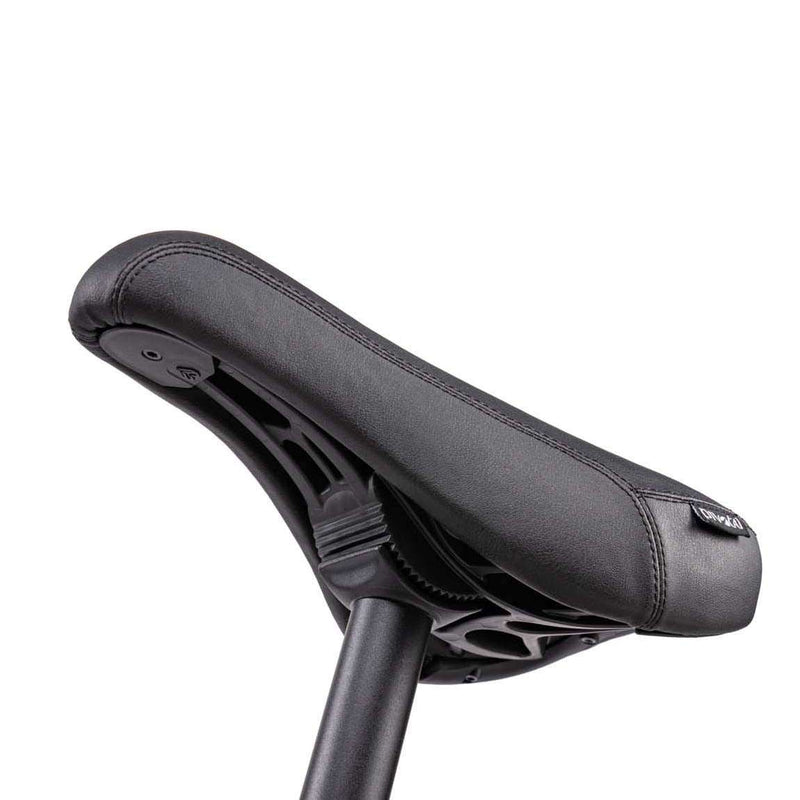 Close-up of the black Wethepeople Justice Bike padded saddle and seat post against a white background